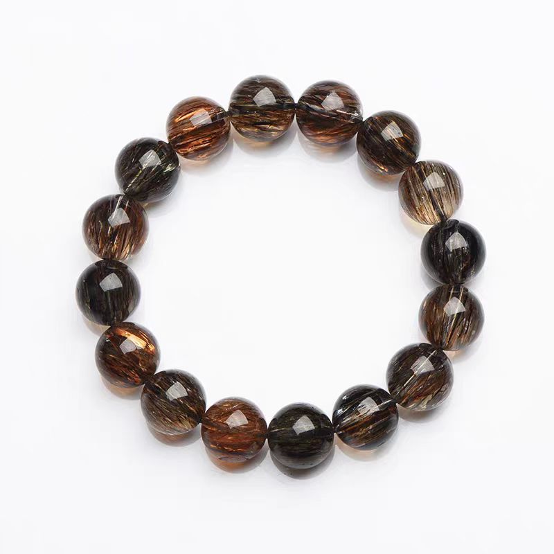 Beaded bracelet with brown and black beads on a white background