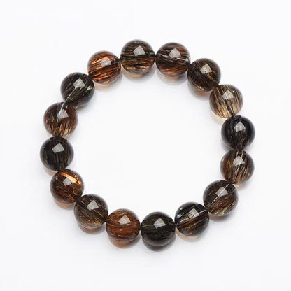 Beaded bracelet with brown and black beads on a white background