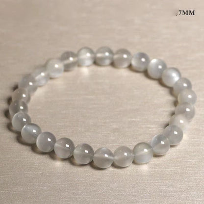 Beaded bracelet with small beads on a beige background