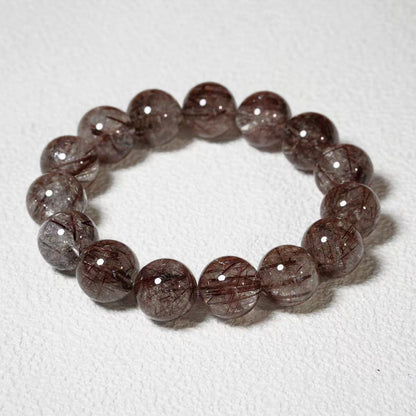 Beaded bracelet with brown and gray stones on a white background