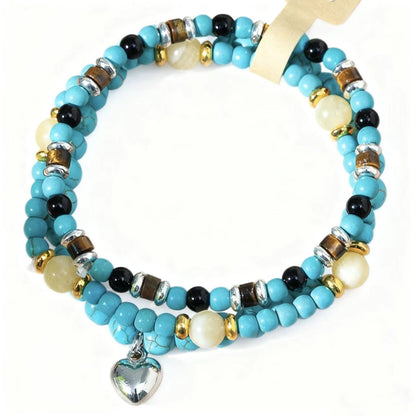Multistrand beaded bracelet with turquoise beads and heart charm on a white background
