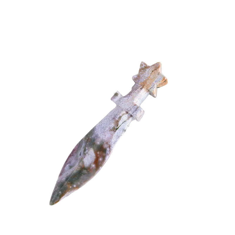 Decorative dagger with a marble-like handle on a white surface